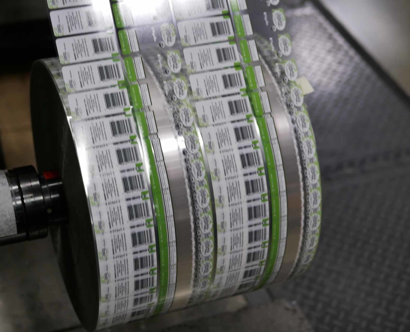 Large spool of labels being printed at a high rate