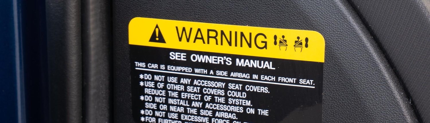 Side view of a car warning sticker